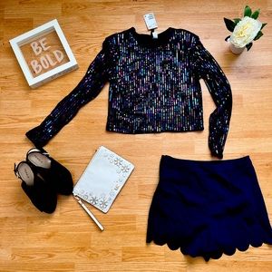 Sequins clubwear velvet top with padding on shoulders for sleek look.